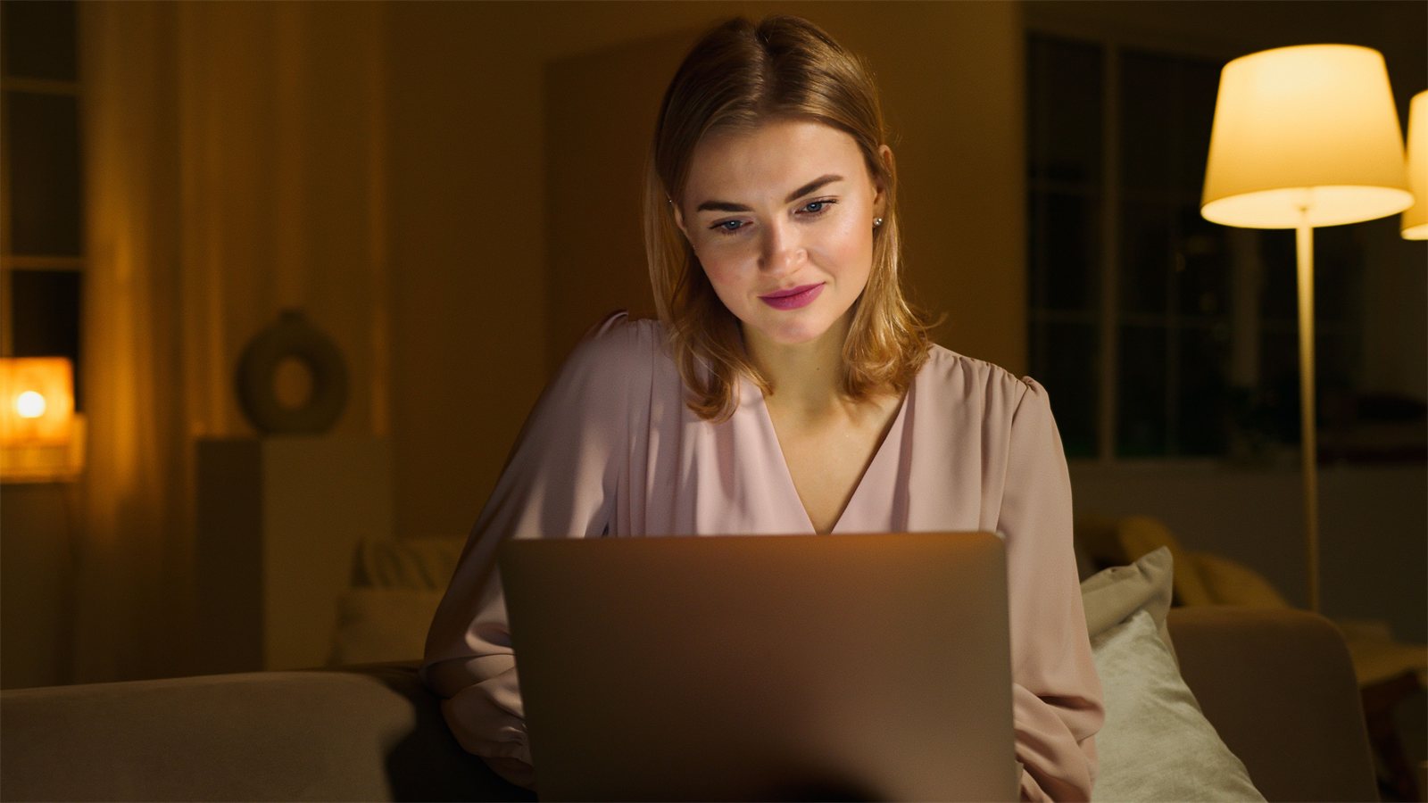 A Tech Academy student learning on a laptop at home