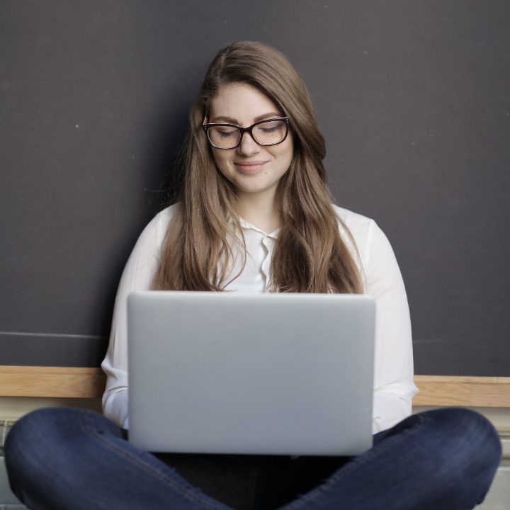 A student researching financing options on a laptop