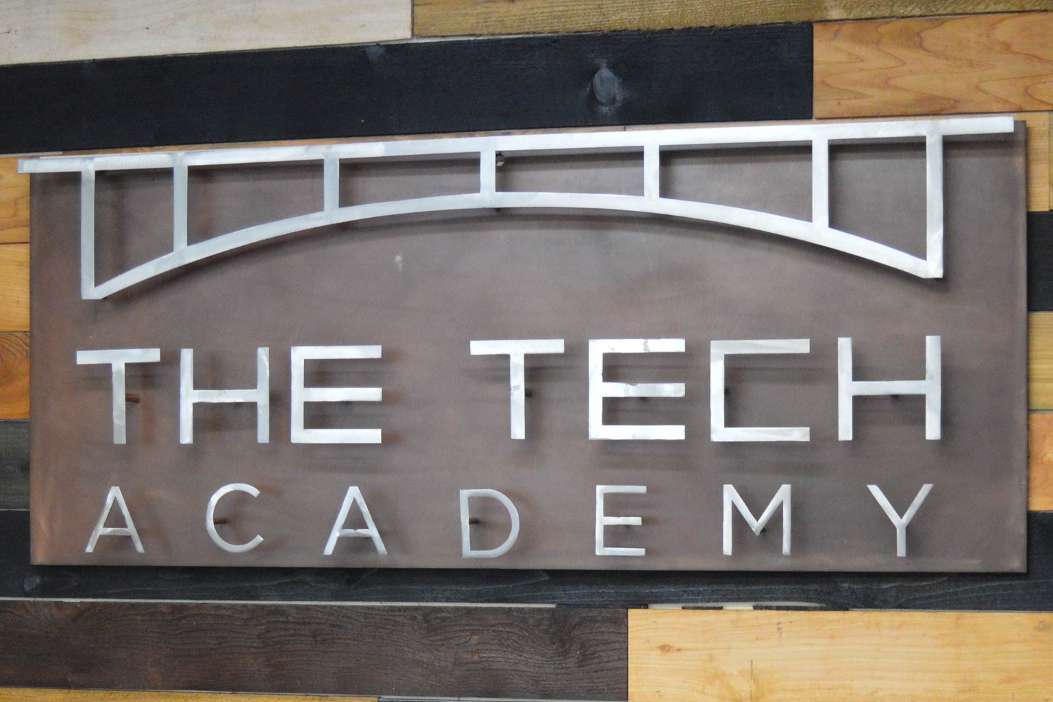 The Tech Academy bridge logo sign